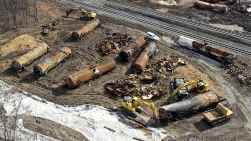 FILE - Cleanup continues on Feb. 24, 2023, at the site of a Norfolk Southern freight train derailment that happened on Feb. 3 in East Palestine, Ohio. The union that represents locomotive engineers says a coal train derailment in Virginia Thursday, July 6, is renewing questions about Norfolk Southern's safety practices. (AP Photo/Matt Freed, File)