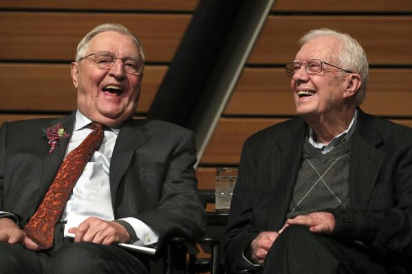 FILE - In this Saturday, Jan. 13, 2018, file photo, former Vice President Walter Mondale, left, sits onstage with former President Jimmy Carter during a celebration of Mondale's 90th birthday at the McNamara Alumni Center on the University of Minnesota's campus, in Minneapolis. Mondale, a liberal icon who lost the most lopsided presidential election after bluntly telling voters to expect a tax increase if he won, died Monday, April 19, 2021. He was 93. (Anthony Souffle/Star Tribune via AP, File)