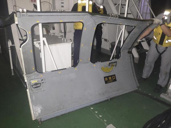 This photo provided by the 11th Regional Japan Coast Guard Headquarters, the door that the coast guard found and retrieved from the sea, off Miyako Island, Okinawa Prefecture, southern Japan, Friday, April 7, 2023. Search and rescue operation continued Friday and officials said they found a door and other fragments believed to be of a Japanese army helicopter presumed to have crashed into the sea near southern islands with 10 crew members on board. (11th Regional Japan Coast Guard Headquarters via AP)