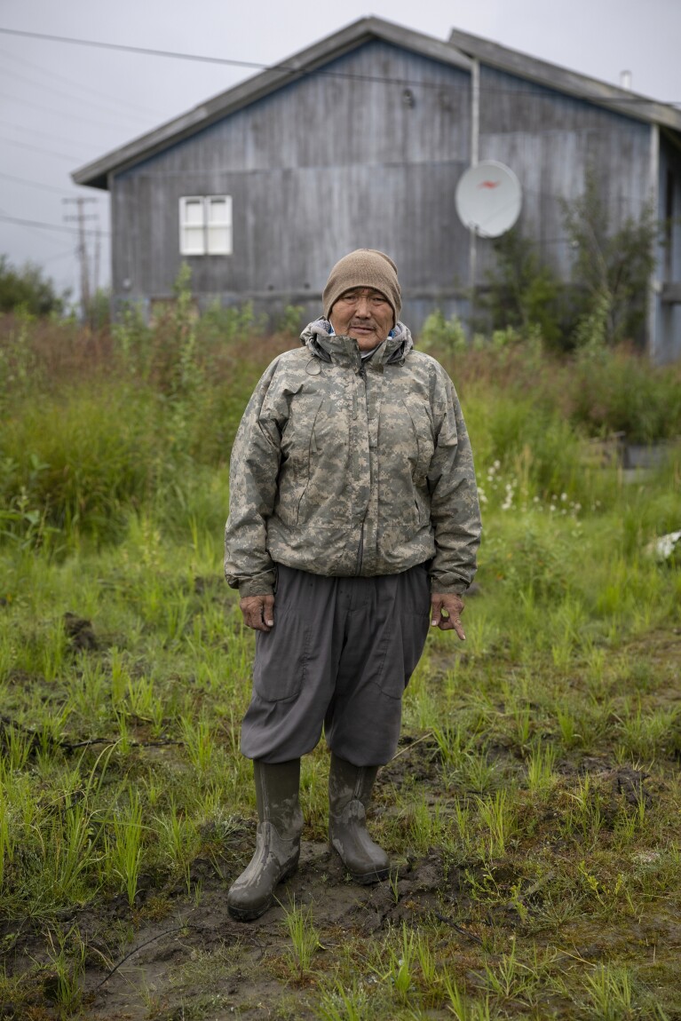 Joseph Moses poses for a portrait on Main Street, Friday, Aug. 18, 2023, in Akiachak, Alaska.  (AP Photo/Tom Brenner)
