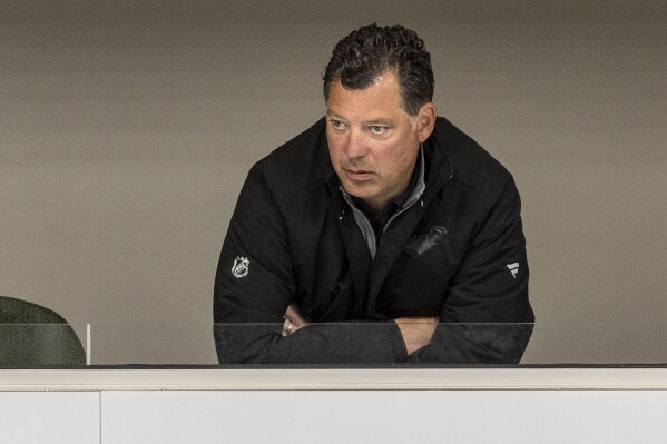 FILE - Minnesota Wild general manager Bill Guerin watches during NHL hockey training camp, Thursday, Sept. 22, 2022, in St. Paul, Minn. Guerin will be responsible for overseeing the building of the United States teams competing in the NHL's 4 Nations Face-Off tournament next year and the 2026 Winter Games, USA Hockey announced on Thursday, Feb. 8, 2024. (Carlos Gonzalez/Star Tribune via AP, File)