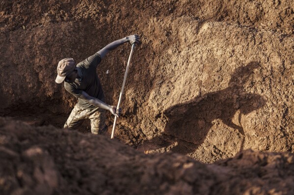 A gold miner works in Senegal's Kedougou region Thursday, Jan. 16, 2025. (AP Photo/Annika Hammerschlag)