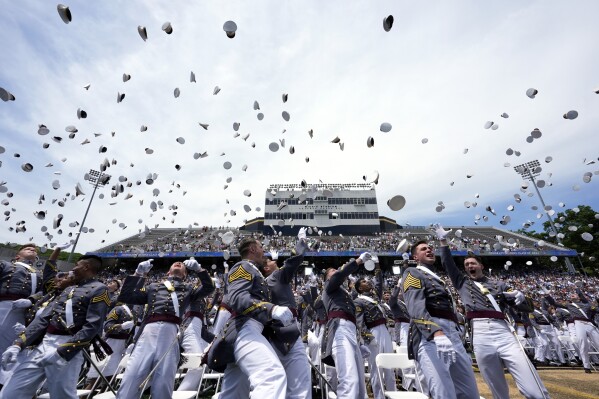 West Point graduates toss their caps into the air at the conclusion of the U.S. Military Academy commencement ceremony, Saturday, May 25, 2024, in West Point, N.Y. (AP Photo/Alex Brandon)