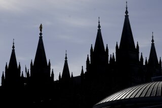 FILE - In this April 4, 2020, file photo, is The Salt Lake Temple of The Church of Jesus Christ of Latter-day Saints in Salt Lake City.  James Huntsman, a member of one of Utah's most prominent families and brother of a former governor, sued The Church of Jesus Christ of Latter-day Saints, accusing it of fraud and seeking to recover millions of dollars in contributions. The federal lawsuit, filed Monday, March 22, 2021, asserts that the church spent members’ donations that were solicited for charity on commercial purposes.  (AP Photo/Rick Bowmer, File)