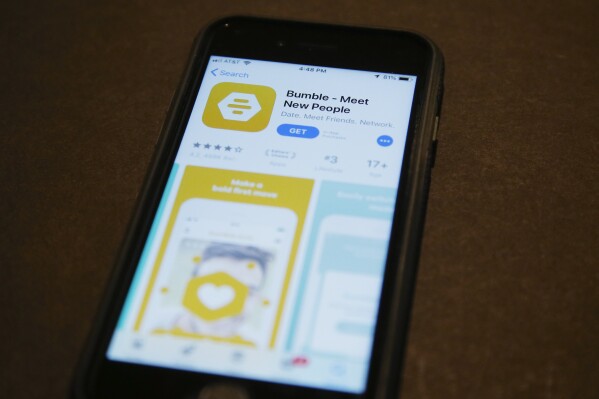 FILE - A phone with an App Store selection of the dating app Bumble is pictured Thursday, Aug. 29, 2019, in Oklahoma City. The dating app Bumble got stung after running billboard ads that appeared to sneer at celibacy as an alternative to meeting people online. The company backtracked Monday, May 13, 2024, apologizing for billboards that bore the message “You know full well a vow of celibacy is not the answer,” juxtaposed with an introduction to “the new Bumble.” (AP Photo/Sue Ogrocki, File)