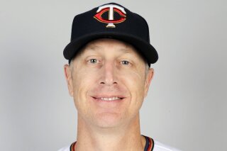 FILE - This is a 2020 file photo showing Mike Bell of the Minnesota Twins baseball team. Bell has died of kidney cancer. He was 46. He was the younger brother of Cincinnati Reds manager David Bell. (AP Photo/Brynn Anderson, File)