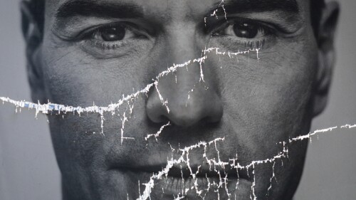 FILE - A partially damaged poster of Spanish Prime Minister and Socialist Party candidate Pedro Sanchez flaps in Parla, outskirts Madrid, Spain, Friday, April 26, 2019. Most polling shows the conservative Popular Party is set to win the ballot and be in position to form a coalition government with the far-right Vox party in the July 23 general election. But Sánchez has proven he can pull off the unexpected. (AP Photo/Bernat Armangue, File)