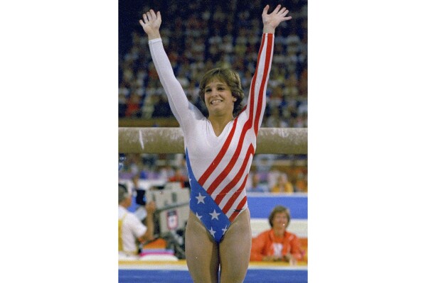 Mary Lou Retton reacts to applause after her performance at the Summer Olympics in Los Angeles on Aug. 3, 1984. (AP Photo/Suzanne Vlamis, File)