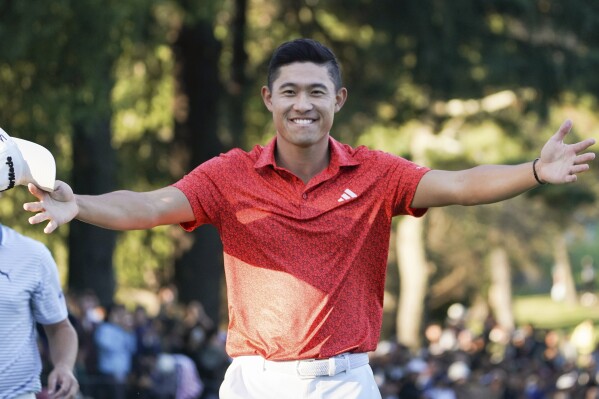 Collin Morikawa of the United States gestures to his wife Katherine Zhu, not pictured, after winning the PGA Tour Zozo Championship at the Narashino Country Club in Inzai on the outskirts of Tokyo, Sunday, Oct. 22, 2023. (AP Photo/Tomohiro Ohsumi)