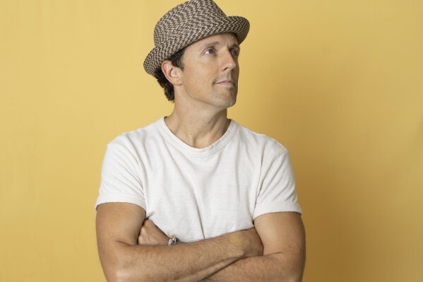 Musician Jason Mraz poses for a portrait in New York on Aug. 15, 2023. Mraz released his latest album “Mystical Magical Rhythmical Radical Ride” in June, a pop record that’s a turn from his balladeering, acoustic persona. (AP Photo/Gary Gerard Hamilton)