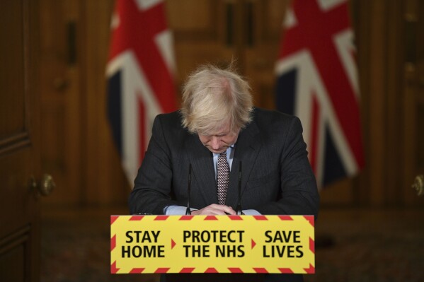 FILE - Britain'sPrime Minister Boris Johnson reacts while leading a virtual news conference on the COVID-19 pandemic, inside 10 Downing Street in central London on Jan. 26, 2021. Former U.K. Prime Minister Johnson says he’s quitting as a lawmaker after being told he will be sanctioned for misleading Parliament. Johnson quit on Friday, June 9, 2023 after receiving the results of an investigation by lawmakers over misleading statements he made to Parliament about a slew of gatherings in government that breached pandemic lockdown rules. (Justin Tallis/Pool via AP, File)