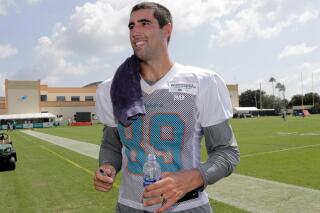 FILE - Miami Dolphins tight end Gavin Escobar walks off the field at the NFL team's training camp, July 26, 2018, in Davie, Fla. Two rock climbers, including the former NFL player, were found dead near a Southern California peak after rescue crews responded to reports of injuries, authorities said Wednesday, Sept. 29, 2022. (AP Photo/Lynne Sladky)