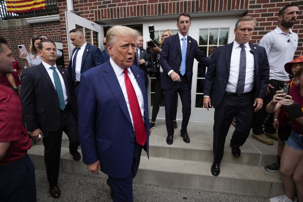 Former President Donald Trump visits the Alpha Gamma Rho, agricultural fraternity, at Iowa State University before an NCAA college football game between Iowa State and Iowa, Saturday, Sept. 9, 2023, in Ames, Iowa. (AP Photo/Charlie Neibergall)