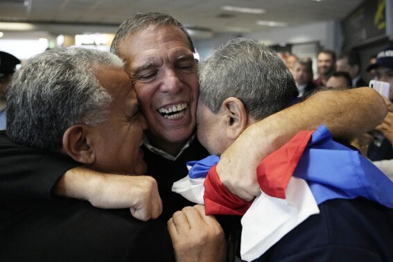 Juan Angel Napout, the former president of soccer’s South American governing body, is received by relatives and friends after landing at Silvio Pettirossi Airport in Luque, Paraguay, Friday, July 7, 2023. Napout was released from a federal prison in Miami and deported to Paraguay after serving 5 1/2 years of his sentence for a Dec. 22, 2017 conviction on one count of racketeering conspiracy and two counts of wire fraud conspiracy. (AP Photo/Jorge Saenz)