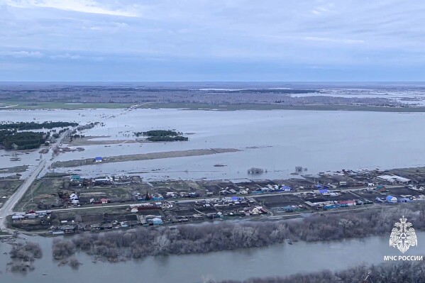 In this grab taken from a video released by the Russian Emergency Ministry Press Service on Tuesday, April 16, 2024, an air-view of the flooded area at Tobol river in the Kurgan region, Russia. Nearly 14,500 homes have been flooded in a Russian region bordering Kazakhstan after water levels spiked in a local river, local authorities said Tuesday. (Russian Emergency Ministry Press Service via AP)