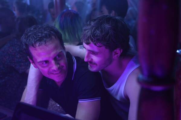 This image released by Searchlight Pictures shows Andrew Scott, left, and and Paul Mescal in a scene from "All of Us Strangers." (Parisa Taghizadeh/ Searchlight Pictures via AP)