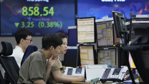 Currency traders watch monitors at the foreign exchange dealing room of the KEB Hana Bank headquarters in Seoul, South Korea, Friday, June 30, 2023. Shares were mixed Friday in Asia after China reported slower factory activity in June due to weaker consumer spending and export demand. (AP Photo/Ahn Young-joon)