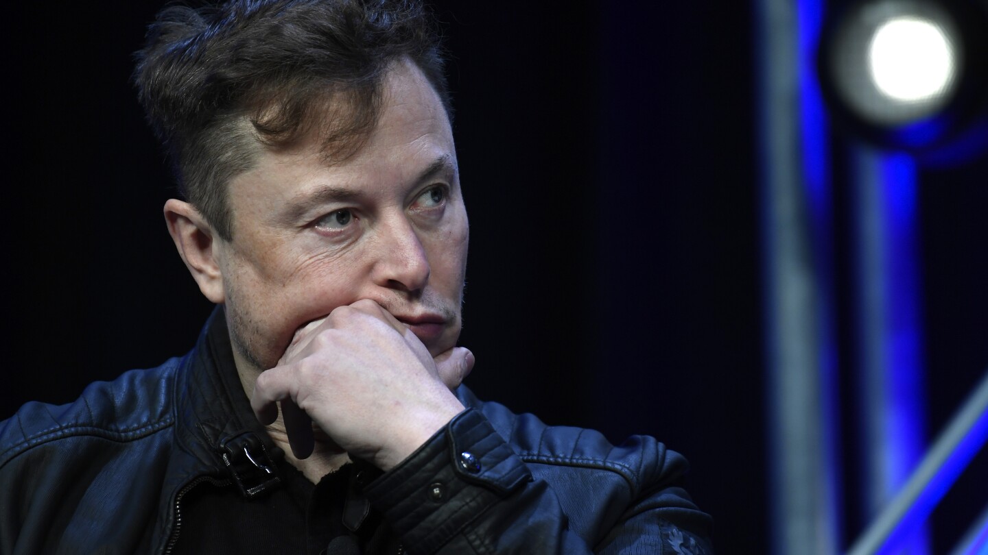 FILE - Tesla and SpaceX chief executive officer Elon Musk listens to a question as he speaks at the SATELLITE Conference and Exhibition in Washington,