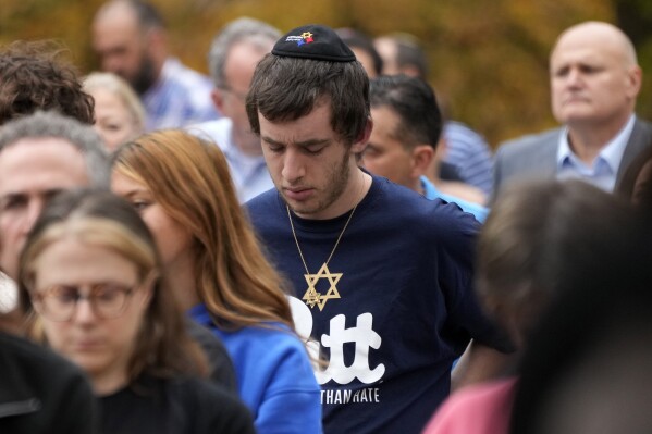 People gather for a Commemoration Ceremony, on Friday, Oct. 27, 2023, in Schenley Park, in the Squirrel Hill neighborhood of Pittsburgh, to remember the 11 worshippers killed by a gunman at the Tree of Life synagogue five years ago. (AP Photo/Gene J. Puskar)
