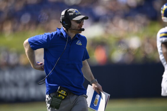FILE - Delaware head coach Ryan Carty looks on during the second half of an NCAA college football game against Navy, Saturday, Sept. 3, 2022, in Annapolis, Md. Coastal Carolina and Delaware will play a home-and-home football series in 2026 and 2029. (AP Photo/Nick Wass, File)