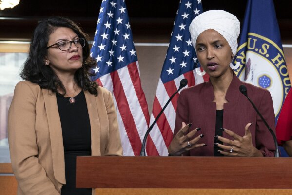 FILE - In this July 15, 2019, file photo, U.S. Rep. Ilhan Omar, D-Minn, right, speaks, as U.S. Rep. Rashida Tlaib, D-Mich. listens, during a news conference at the Capitol in Washington. The U.S. envoy to Israel said he supports Israel's decision to deny entry to two Muslim congresswomen ahead of their planned visit to Jerusalem and the West Bank. Ambassador David Friedman said Thursday, Aug. 15, 2019, in a statement following the Israeli government's announcement that Israel "has every right to protect its borders" against promoters of boycotts "in the same manner as it would bar entrants with more conventional weapons." (AP Photo/J. Scott Applewhite, File)