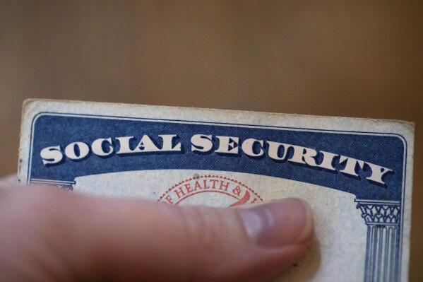 FILE - A Social Security card is displayed on Oct. 12, 2021, in Tigard, Ore. The annual Social Security and Medicare trustees report released Thursday, June 2, 2022, says Social Security’s trust fund will be unable to pay full benefits in 2035, instead of last year's estimate of 2034, and the year before that which estimated an exhaustion date of 2035. (ĢӰԺ Photo/Jenny Kane, File)