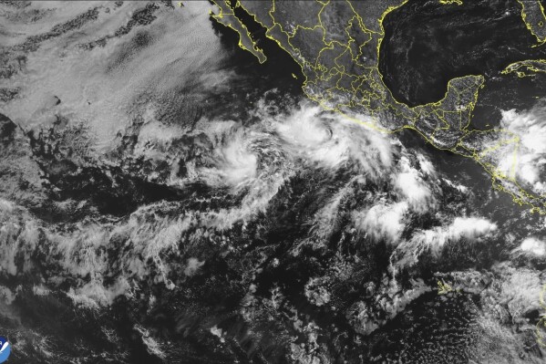 In this satellite image released by NOAA, Tropical Storm Barbara forms off the southwest coast of Mexico. (NOAA via AP)