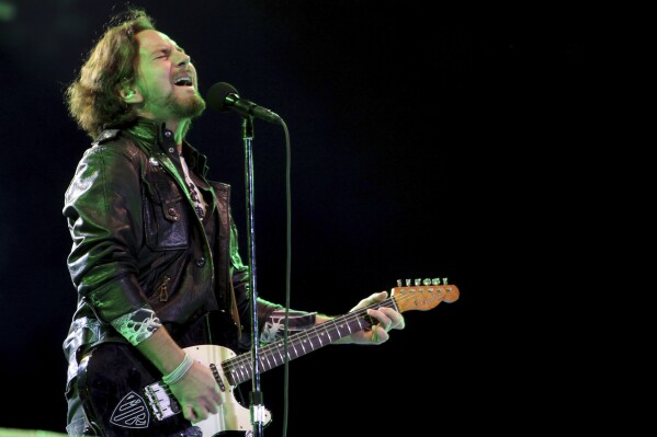 FILE - Pearl Jam's lead vocalist Eddie Vedder performs in concert in Sao Paulo, Brazil on Nov. 3, 2011. Pearl Jam's forthcoming album shows the rockers are not mellowing with age. Vedder and other members of the band that began in Seattle in the early 1990s gave an advance listen of their 12th studio album to a select group of family, friends and industry insiders on Wednesday, Jan. 31, 2024, at the Troubadour club in the Los Angeles area. Vedder told the crowd the album is 鈥渙ur best work.鈥� (AP Photo/Andre Penner, File)