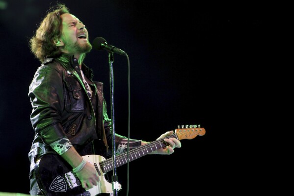 FILE - Pearl Jam's lead vocalist Eddie Vedder performs in concert in Sao Paulo, Brazil on Nov. 3, 2011. Pearl Jam's forthcoming album shows the rockers are not mellowing with age. Vedder and other members of the band that began in Seattle in the early 1990s gave an advance listen of their 12th studio album to a select group of family, friends and industry insiders on Wednesday, Jan. 31, 2024, at the Troubadour club in the Los Angeles area. Vedder told the crowd the album is “our best work.” (AP Photo/Andre Penner, File)