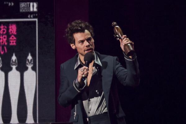 Harry Styles on stage accepting the award for Artist of the Year at the Brit Awards 2023 in London, Saturday, Feb. 11, 2023. (Photo by Vianney Le Caer/Invision/AP)
