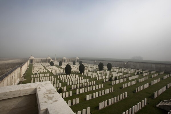 FILE - Mist gathers on the horizon at Dud's Corner World War I Cemetery in Loos-en-Gohelle, France, on March 13, 2014. On Wednesday, Sept. 20, 2023, First World War cemeteries and memorial sites in Belgium and France were added to the UNESCO World Heritage List during the annual meeting of the World Heritage Committee. (AP Photo/Virginia Mayo, File)