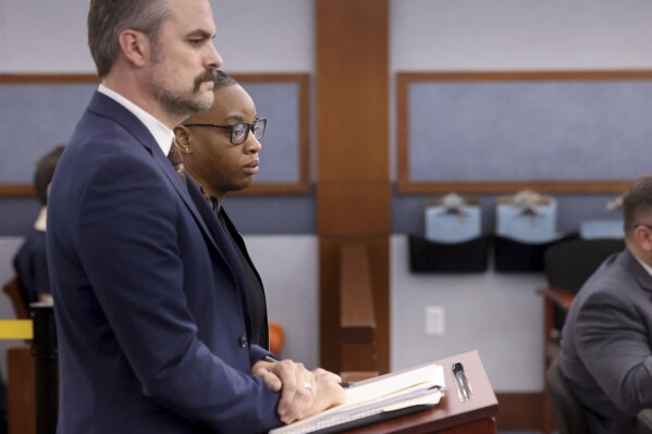 Las Vegas Aces WNBA basketball player Riquna Williams appears in court in Las Vegas with her attorney Brandon Albright, Thursday, Sept. 7, 2023. Criminal domestic violence charges were dismissed Thursday against Riquna Williams after a prosecutor said her wife, her alleged victim in a July 25 incident at their home, refused to appear for a preliminary hearing to determine if the case should go to trial.(K.M. Cannon/Las Vegas Review-Journal via AP)