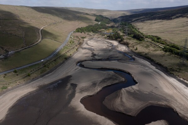 Low water levels are visible at Woodhead Reservoir in Derbyshire as the area experiences a significant drought, in Woodhead, England, Monday, May 19, 2025. (AP Photo/Jon Super, File)