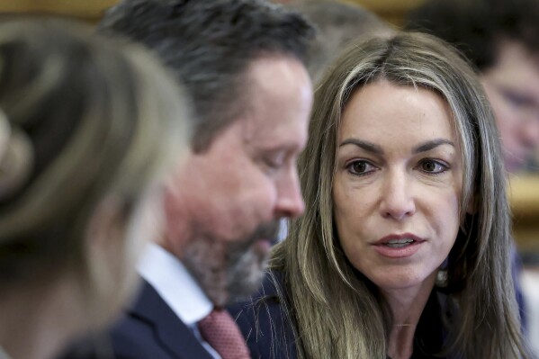 Defendant Karen Read speaks with her attorney Alan Jackson during her murder trial in Norfolk Superior Court in Dedham, Mass., Friday, May 30, 2025. (Mark Stockwell/The Sun Chronicle via AP, Pool)