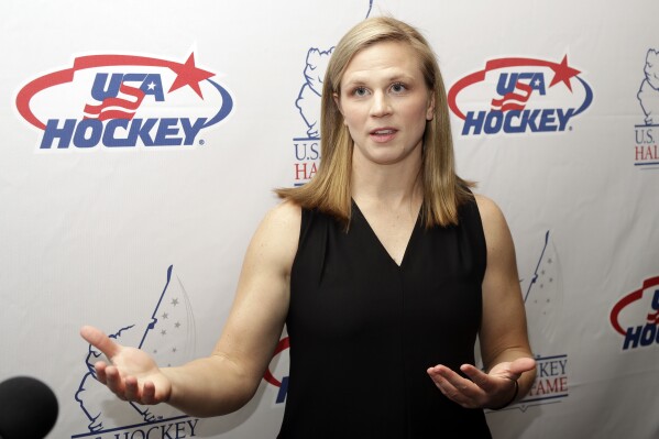 FILE - Three-time Olympic medalist Natalie Darwitz answers questions before being inducted into the U.S. Hockey Hall of Fame, Wednesday, Dec. 12, 2018, in Nashville, Tenn. Retired United States national team captain Natalie Darwitz and former Team Canada coach Daniele Sauvageau lead a list of four women and two men named general managers of the newly established Professional Women's Hockey League's Original Six franchises, Friday, Sept. 1, 2023. (AP Photo/Mark Humphrey, File)