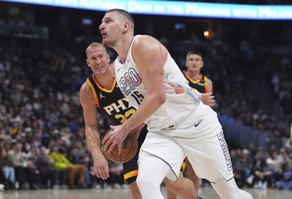 Nikola Jokic makes NBA history with 30-20-20 triple-double in Nuggets' OT  win over Suns | AP News