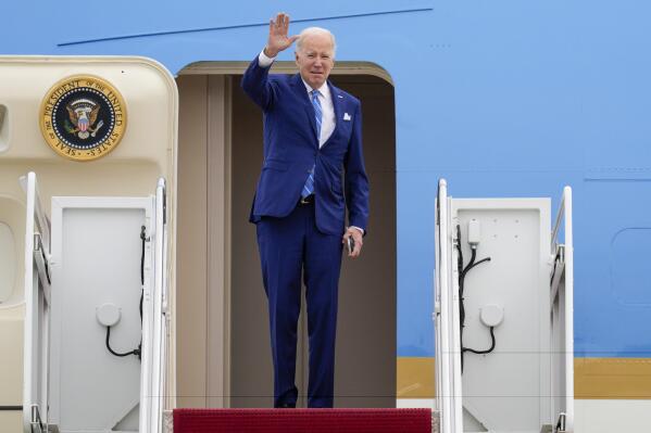 FILE - President Joe Biden waves as he boards Air Force One at Andrews Air Force Base, Md., Thursday, Feb. 9, 2023, en route to Florida. When Joe Biden was running for president three years ago, he flew on a white private jet with his campaign logo painted on the side. Now he has a larger, more recognizable ride as he seeks a second term. Like his predecessors, he'll be crisscrossing the country on Air Force One. (AP Photo/Jess Rapfogel, File)