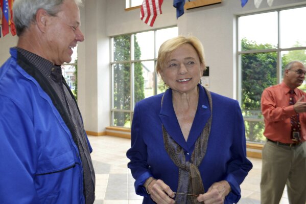 
              Democratic Attorney General and gubernatorial candidate Janet Mills speaks with people following a gubernatorial forum, Thursday, Oct. 4, 2018, in Waterville, Maine. Mills will face Republican Shawn Moody, and independent candidates Alan Caron and Terry Hayes in the November general election. (AP Photo/Marina Villeneuve)
            