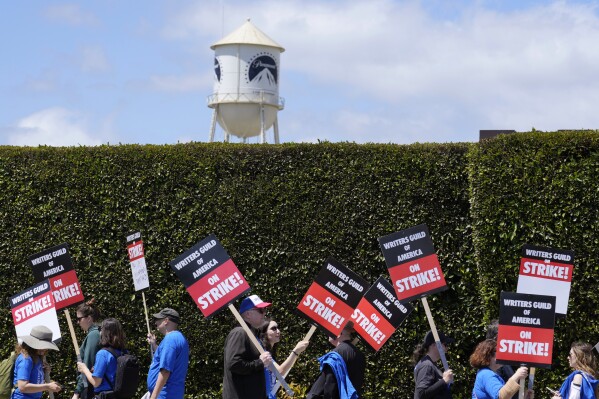 FILE - Striking writers take part in a rally in front of Paramount Pictures studio, Tuesday, May 2, 2023, in Los Angeles. A tentative deal was reached, Sunday, Sept. 24, 2023, to end Hollywood’s writers strike after nearly five months. (AP Photo/Chris Pizzello, File)