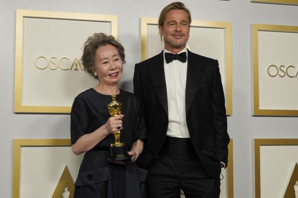 Brad Pitt, right, poses with Yuh-Jung Youn, winner of the award for best actress in a supporting role for "Minari," in the press room at the Oscars on Sunday, April 25, 2021, at Union Station in Los Angeles. (AP Photo/Chris Pizzello, Pool)