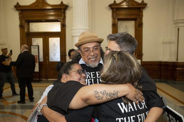 Maggie Luna, of the Texas Center for Justice and Equity, left to right, anti-death penalty activist Leno Rose-Avila, Jennifer Rhonda Gilbert, of Brownsville, and Jennifer Toon of Lioness Justice Impacted Women's Alliance, who are supporters of death row inmate Melissa Lucio, celebrate outside the Governor's office at the Capitol, in Austin, Texas, on Monday, April 25, 2022. The Texas Court of Criminal Appeals halted the execution of Lucio with two days to spare. (Jay Janner/Austin American-Statesman via AP)
