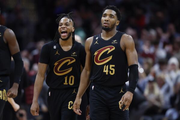 Cleveland Cavaliers guard Darius Garland (10) celebrates with guard Donovan Mitchell (45) during the second half of an NBA basketball game against the Boston Celtics, Monday, March 6, 2023, in Cleveland. (AP Photo/Ron Schwane)