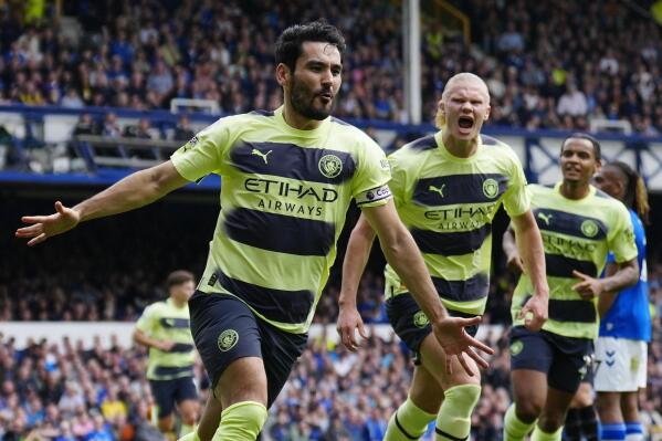 Manchester City's Ilkay Gundogan celebrates after scoring his side's opening goal during the English Premier League soccer match between Everton and Manchester City at the Goodison Park stadium in Liverpool, England, Sunday, May 14, 2023. (AP Photo/Jon Super)