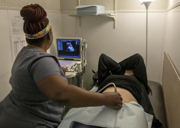 FILE - An operating room technician performs an ultrasound on a patient at Hope Medical Group for Women in Shreveport, La., on July 6, 2022. The Louisiana Supreme Court on Friday, Aug. 12, 2022, denied an appeal filed by plaintiffs in the ongoing legal battle over the state’s abortion ban, allowing the ban to stay in effect. (AP Photo/Ted Jackson, File)