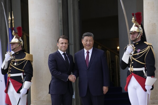 French President Emmanuel Macron shakes hands with China's President Xi Jinping before their meeting at the Elysee Palace, Monday, May 6, 2024 in Paris. French President Emmanuel Macron is welcoming China's Xi Jinping for a two-day state visit to France and is seeking to press Xi to use his influence on Moscow to move toward ending the war in Ukraine. (AP Photo/Christophe Ena)