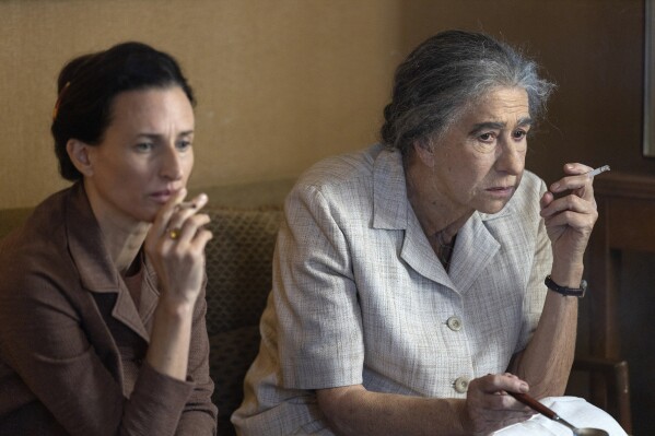 This image released by Bleecker Street shows Camille Cottin, left, and Helen Mirren as Golda Meir in a scene from. the film 