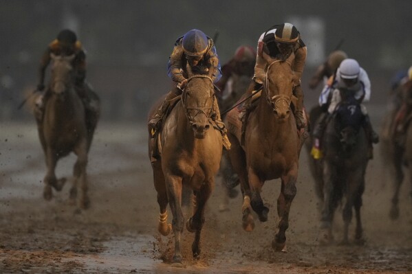 Sovereignty, ridden by Junior Alvarado, crosses the finish line to win the 151st running of the Kentucky Derby horse race at Churchill Downs Saturday, May 3, 2025, in Louisville, Ky. (AP Photo/Brynn Anderson)