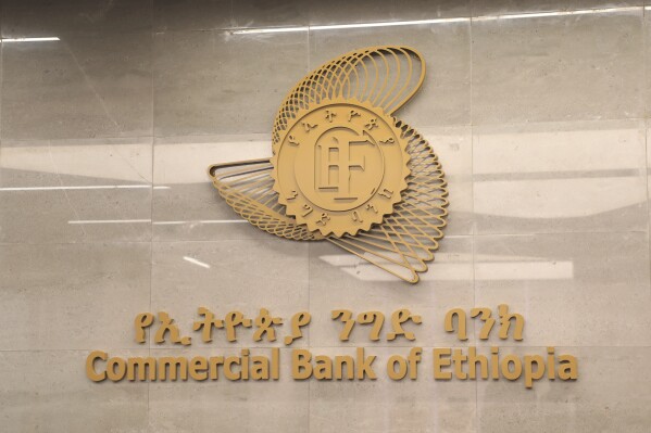 Commercial Bank of Ethiopia signage seen outside a branch in Addis Ababa, Ethiopia Tuesday, March. 26, 2024. Ethiopia's biggest bank says it has recouped nearly 80% of the cash it lost during a 