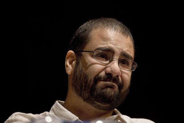 FILE - Egypt's leading pro-democracy activist Alaa Abdel-Fattah speaks during a conference at the American University in Cairo, Egypt, Sept. 22, 2014. The family of imprisoned activist Abdel-Fattah said that he will go on a full hunger strike starting Tuesday, Nov. 2, 2022, and that he will stop drinking water on the first day of the country hosting the global climate summit COP27 next week. (AP Photo/Nariman El-Mofty, File)