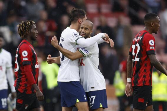 Tottenham's Lucas Moura, right, and Tottenham's Rodrigo Bentancur celebrate at the end of the English Premier League soccer match between Bournemouth and Tottenham Hotspur at Vitality Stadium in Bournemouth, England, Saturday, Oct. 29, 2022. (AP Photo/David Cliff)